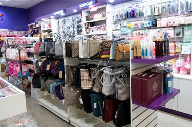 Handbags and other products on shelf at Beauty Mart in Dutton Plaza