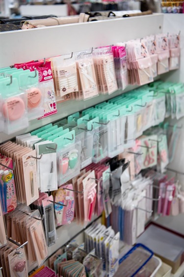 Shelf of various beauty maintenance tools sold at Beauty Mart in Dutton Plaza