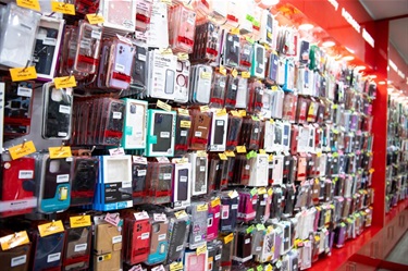 Shelf space displaying various mobile phone cases at Cabramatta Phones in Dutton Plaza