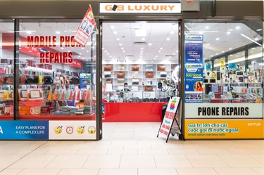 Entrance to GB Luxury mobile phone repairs store at Dutton Plaza