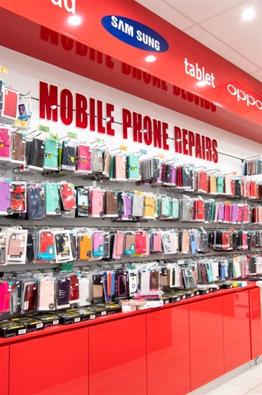 Shelf space with various mobile phone covers at GB Luxury in Dutton Plaza