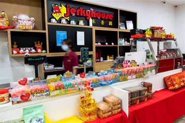 Front counter of Jerky House in Dutton Plaza featuring lollies and other food products for sale