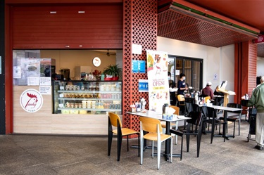 Counter and outdoor seating at Lam Ky Noodle House at Dutton Plaza