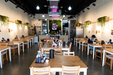 Inside Lucky Cat Vietnamese Restaurant at Dutton Plaza with view of tables, seating and counter