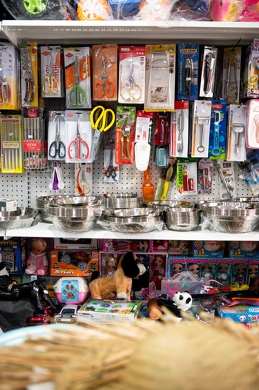 Various household items at Senselected Trading in Dutton Plaza, such as toys, metal bowls, scissors and peelers