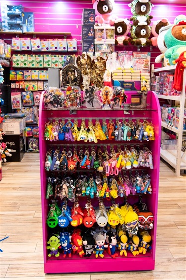 Shelf space at Sydney Morning Glory displaying range of merchandise from colourful fictional character-based brands like Dragon Ball, Avengers and Naruto