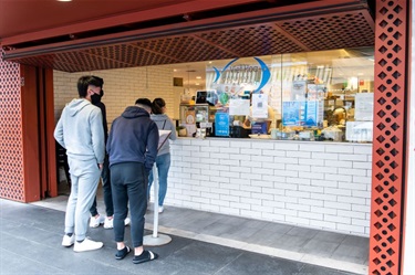 People queuing outside Viet Hoa Oyster Bar at Dutton Plaza