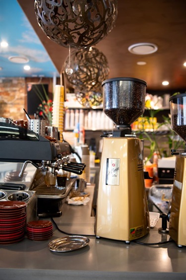 Coffee machine and other kitchen equipment and crockery at Vy Vy Cafe in Dutton Plaza