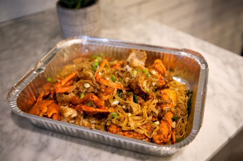 Crab and noodle meal on table at Viet Hoa Oyster Bar in Dutton Plaza